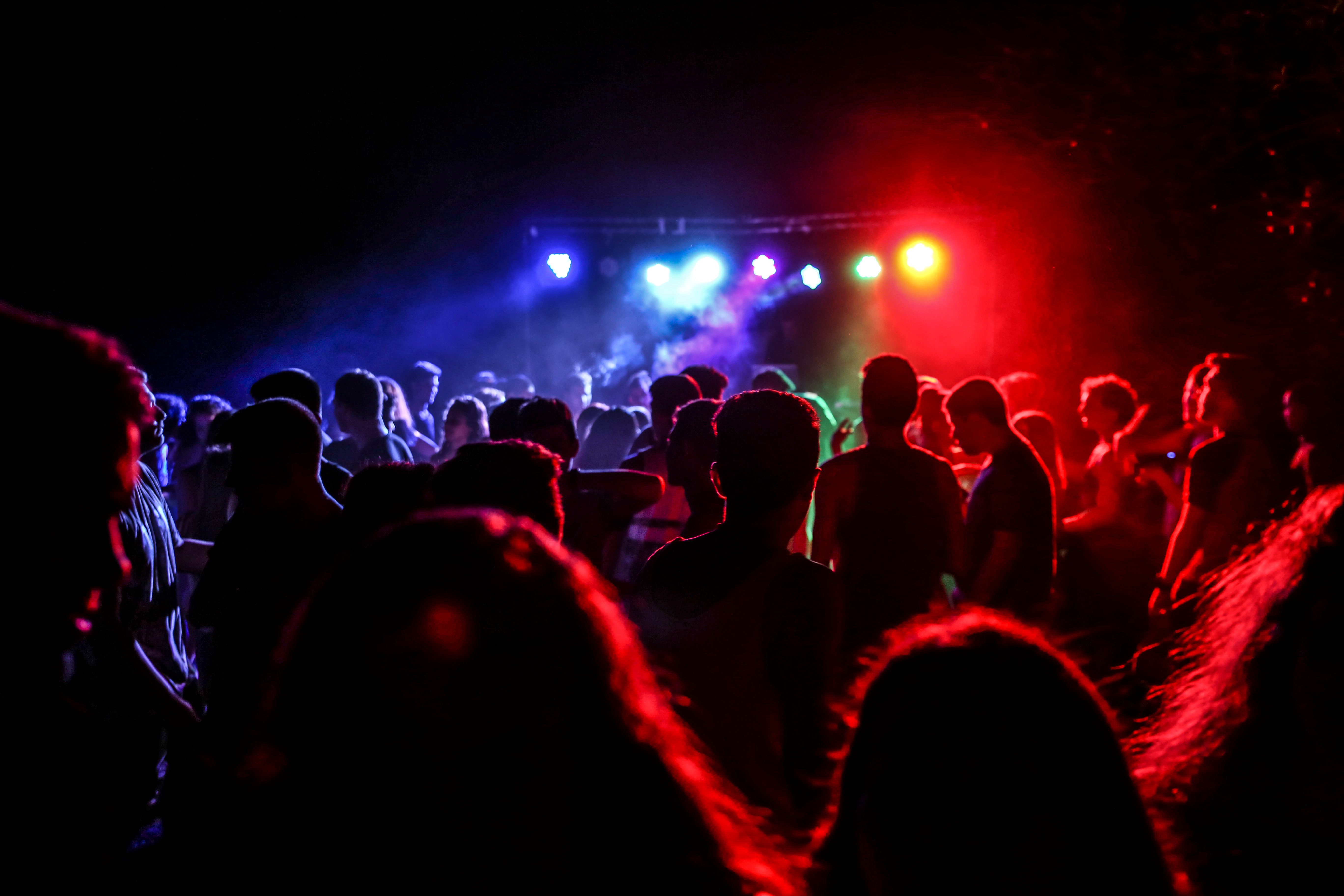 People dancing and celebrating at a nightclub