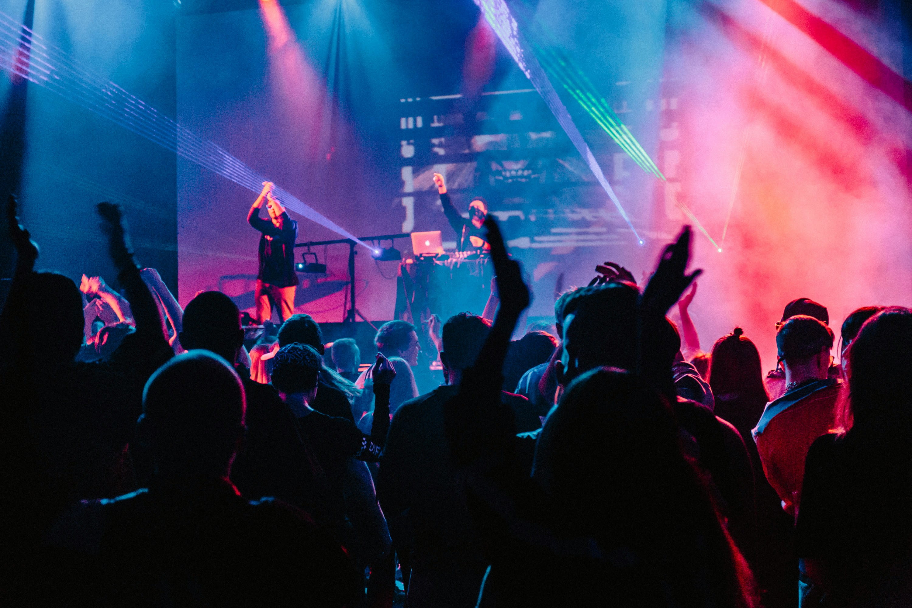 People dancing and celebrating at a nightclub